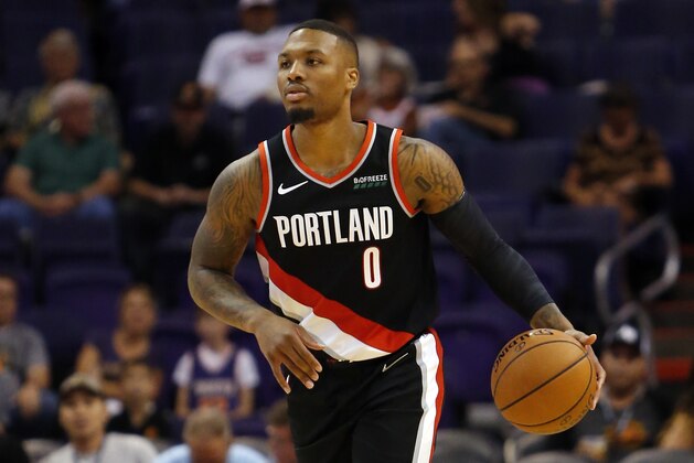 Portland Trail Blazers guard Damian Lillard (0) in the first half during an NBA preseason basketball game against the Phoenix Suns, Friday, Oct. 5, 2018, in Phoenix. (AP Photo/Rick Scuteri)