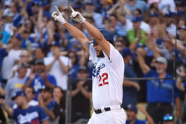 LOS ANGELES, CA - OCTOBER 17:  Clayton Kershaw #22 of the Los Angeles Dodgers celebrates after scoring against the Milwaukee Brewers during the seventh inning in Game Five of the National League Championship Series at Dodger Stadium on October 17, 2018 in Los Angeles, California.  (Photo by Kevork Djansezian/Getty Images)