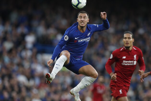 Chelsea's Eden Hazard heads the ball during the English Premier League soccer match between Chelsea and Liverpool at Stamford Bridge stadium in London, Saturday, Sept. 29, 2018. (AP Photo/Frank Augstein)