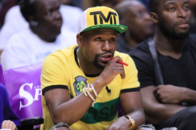 LOS ANGELES, CA - AUGUST 14:  Boxer Floyd Mayweather Jr. attends the New York Liberty vs the Los Angeles Sparks WNBA basketball game at Staples Center on August 14, 2018 in Los Angeles, California.  (Photo by Leon Bennett/Getty Images)