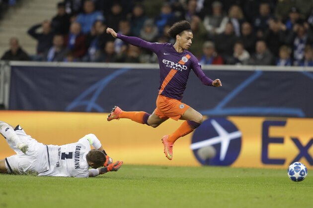 Manchester City midfielder Leroy Sane jumps over Hoffenheim goalkeeper Oliver Baumann during the group F Champions League soccer match between Hoffenheim and Manchester City at the Rhein-Neckar-Arena stadium in Sinsheim, Germany, Tuesday, Oct. 2, 2018. (AP Photo/Michael Probst)
