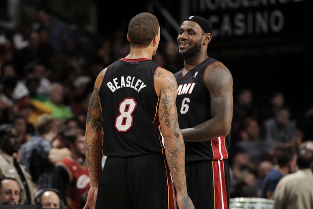 CLEVELAND, OH - NOVEMBER 27:  Michael Beasley #8 and LeBron James #6 of the Miami Heat joke around during a break in the action against the Cleveland Cavaliers at The Quicken Loans Arena on November 27, 2013 in Cleveland, Ohio. NOTE TO USER: User expressly acknowledges and agrees that, by downloading and/or using this Photograph, user is consenting to the terms and conditions of the Getty Images License Agreement. Mandatory Copyright Notice: Copyright 2013 NBAE (Photo by David Liam Kyle/NBAE via Getty Images)