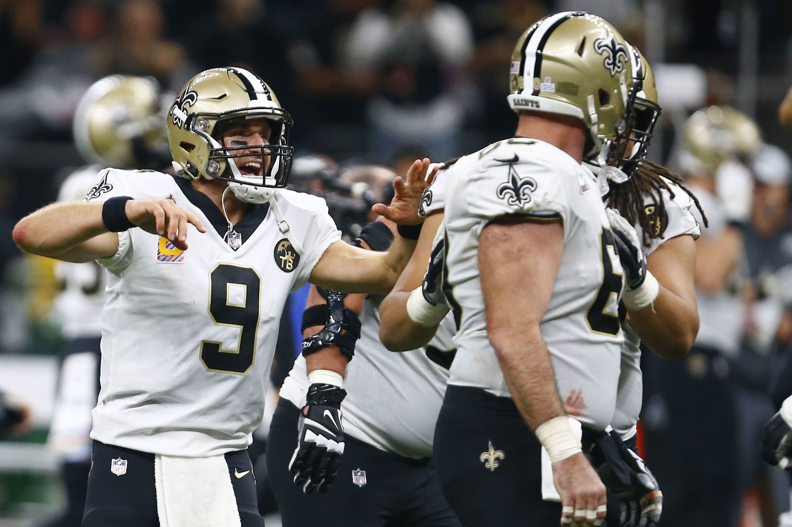 New Orleans Saints quarterback Drew Brees (9) celebrates after he broke the NFL all-time passing yards record in the first half of an NFL football game against the Washington Redskins in New Orleans, Monday, Oct. 8, 2018. (AP Photo/Butch Dill)