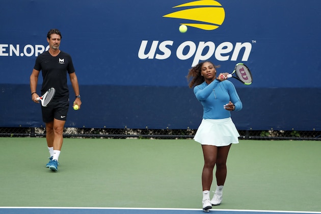 Serena Williams walks on a practice court with her coach Patrick Mouratoglou during the third round of the U.S. Open tennis tournament, Friday, Aug. 31, 2018, in New York. (AP Photo/Adam Hunger)