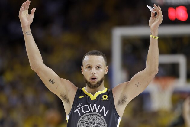 Golden State Warriors guard Stephen Curry (30) celebrates during the second half of Game 2 of basketball's NBA Finals between the Warriors and the Cleveland Cavaliers in Oakland, Calif., Sunday, June 3, 2018. The Warriors won 122-103. (AP Photo/Marcio Jose Sanchez)