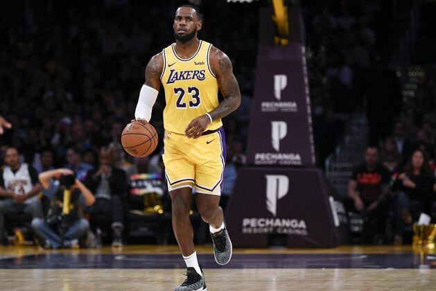 Los Angeles Lakers forward LeBron James takes the ball up the court during the first half of an NBA preseason basketball game against the Sacramento Kings in Los Angeles, Thursday, Oct. 4, 2018. (AP Photo/Kelvin Kuo)