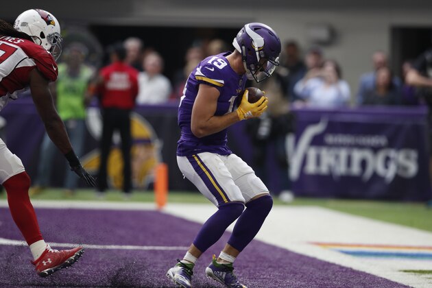 Minnesota Vikings wide receiver Adam Thielen (19) catches a touchdown pass against the Arizona Cardinals during an NFL football game, Sunday, Oct. 14, 2018, in Minneapolis. The Vikings won 27-17. (Jeff Haynes/AP Images for Panini)