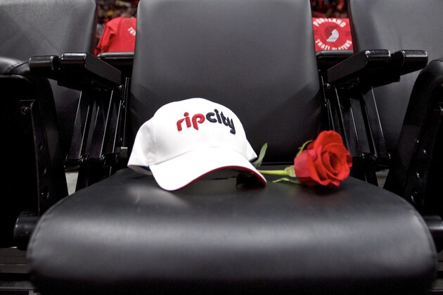 The seat for Trail Blazers owner Paul Allen, who passed away on Oct. 15, has a rose and a hat placed on it before an NBA basketball game in Portland, Ore., Thursday, Oct. 18, 2018. (AP Photo/Craig Mitchelldyer)