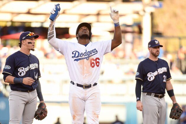 LOS ANGELES, CA - OCTOBER 17:  Yasiel Puig #66 of the Los Angeles Dodgers reacts after hitting a double during the eighth inning against the Milwaukee Brewers in Game Five of the National League Championship Series at Dodger Stadium on October 17, 2018 in Los Angeles, California.  (Photo by Kevork Djansezian/Getty Images)