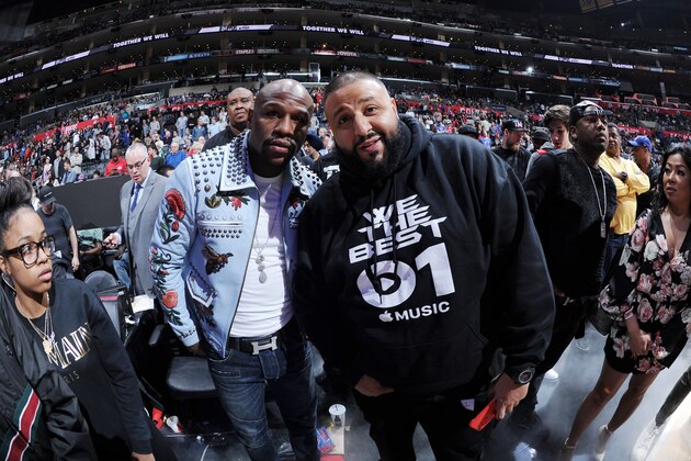 LOS ANGELES, CA - FEBRUARY 20:   Floyd Mayweather Jr. talks with DJ Khaled after the game between the Golden State Warriors and the Los Angeles Clippers on February 20, 2016 at STAPLES Center in Los Angeles, California. NOTE TO USER: User expressly acknowledges and agrees that, by downloading and/or using this Photograph, user is consenting to the terms and conditions of the Getty Images License Agreement. Mandatory Copyright Notice: Copyright 2016 NBAE (Photo by Andrew D. Bernstein/NBAE via Getty Images)