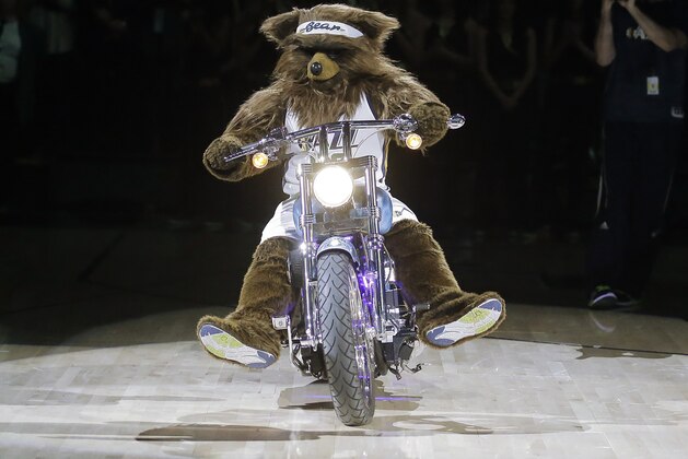 Utah Jazz Bear performs before the start of the first half during an NBA basketball game against the Phoenix Suns Saturday, Dec. 31, 2016, in Salt Lake City. (AP Photo/Rick Bowmer)