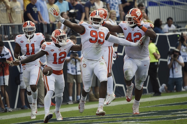 Clemson defensive end Clelin Ferrell (99) celebrates his touchdown against Georgia Tech during the first half of an NCAA college football game, Saturday, Sept. 22, 2018, in Atlanta. (AP Photo/Jon Barash)