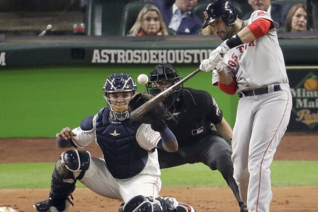 Boston Red Sox's J.D. Martinez hits a home run against the Houston Astros during the third inning in Game 5 of a baseball American League Championship Series on Thursday, Oct. 18, 2018, in Houston. (AP Photo/Lynne Sladky)