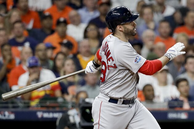 Boston Red Sox's J.D. Martinez watches his home run against the Houston Astros during the third inning in Game 5 of a baseball American League Championship Series on Thursday, Oct. 18, 2018, in Houston. (AP Photo/David J. Phillip)
