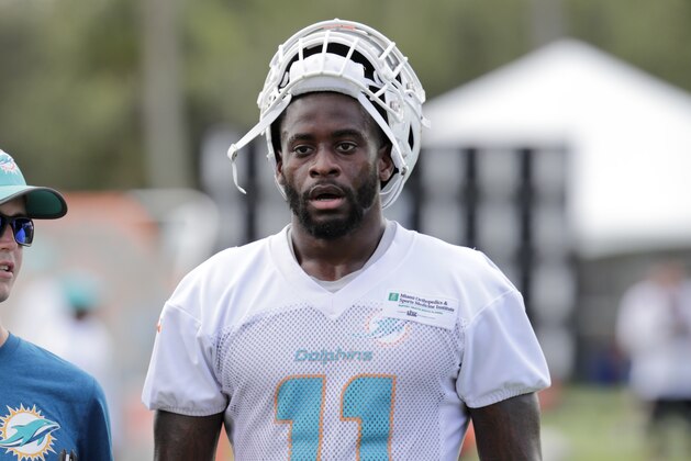 Miami Dolphins wide receiver DeVante Parker (11) walks off the field at the NFL football team's training camp, Friday, July 27, 2018, in Davie, Fla. (AP Photo/Lynne Sladky)