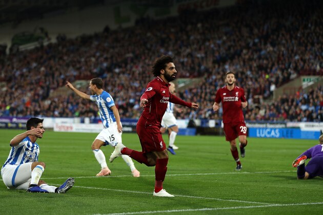HUDDERSFIELD, ENGLAND - OCTOBER 20: Mohamed Salah of Liverpool(C) celebrates after scoring his sides first goal during the Premier League match between Huddersfield Town and Liverpool FC at John Smith's Stadium on October 20, 2018 in Huddersfield, United Kingdom. (Photo by Mark Robinson/Getty Images)