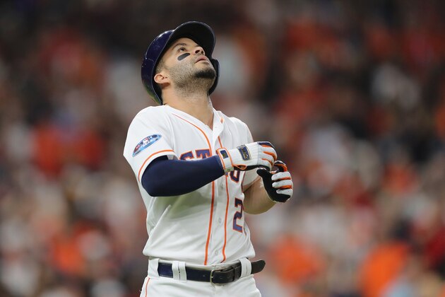 HOUSTON, TX - OCTOBER 18:  Jose Altuve #27 of the Houston Astros reacts after lining out in the eighth inning against the Boston Red Sox during Game Five of the American League Championship Series at Minute Maid Park on October 18, 2018 in Houston, Texas.  (Photo by Elsa/Getty Images)