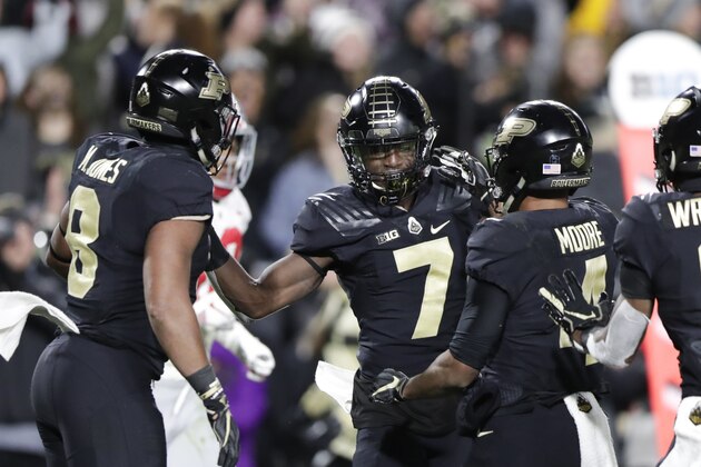 Purdue wide receiver Isaac Zico (7) celebrates a touchdown catch with running back Markell Jones (8) and wide receiver Rondale Moore (4) during the first half of an NCAA college football game against Ohio State in West Lafayette, Ind., Saturday, Oct. 20, 2018. (AP Photo/Michael Conroy)