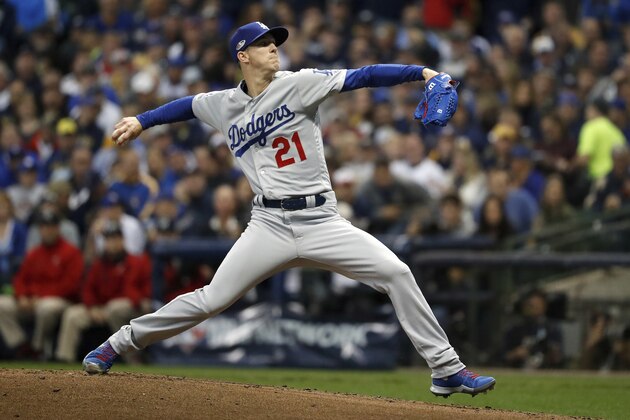 Los Angeles Dodgers starting pitcher Walker Buehler (21) throws during the first inning of Game 7 of the National League Championship Series baseball game against the Milwaukee Brewers Saturday, Oct. 20, 2018, in Milwaukee. (AP Photo/Jeff Roberson)