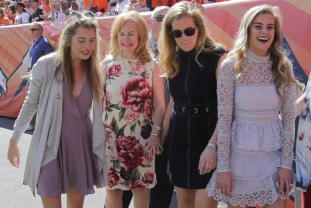 Brittany Bowlen, left, mother Annabel Bowlen, Beth Bowlen and Annabel Bowlen walk off the field prior to the start of an NFL football game against the Oakland Raiders, Sunday, Sept. 16, 2018, in Denver. (AP Photo/Jack Dempsey)
