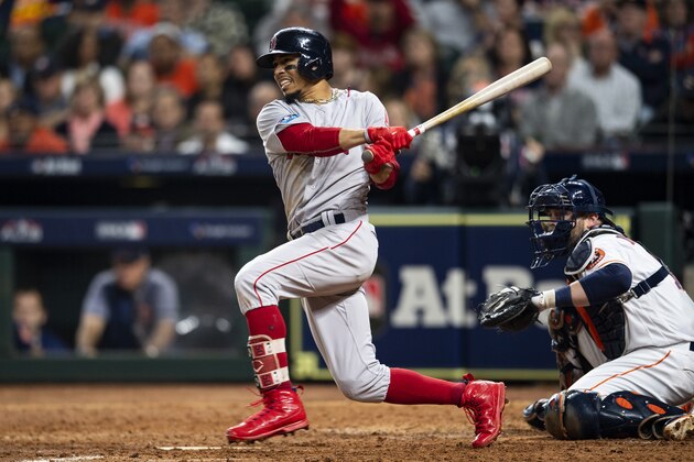 HOUSTON, TX - OCTOBER 17: Mookie Betts #50 of the Boston Red Sox hits a single during the eighth inning of game four of the American League Championship Series against the Houston Astrosat Minute Maid Park on October 17, 2018 in Houston, Texas. (Photo by Billie Weiss/Boston Red Sox/Getty Images)