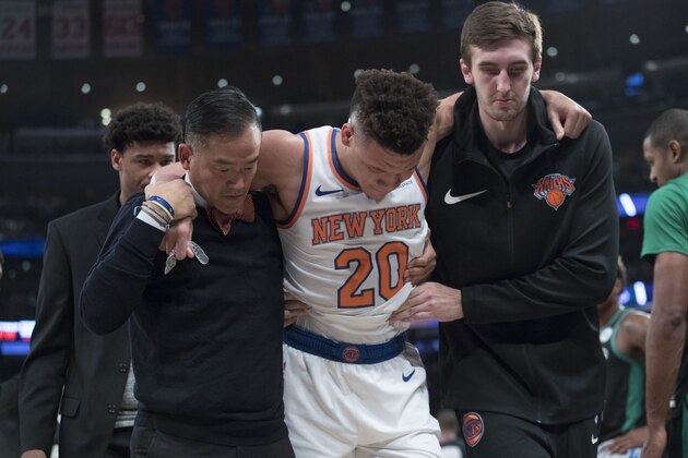 New York Knicks forward Kevin Knox (20) is helped off the court after injuring himself during the first half of an NBA basketball game against the Boston Celtics, Saturday, Oct. 20, 2018, at Madison Square Garden in New York. (AP Photo/Mary Altaffer)