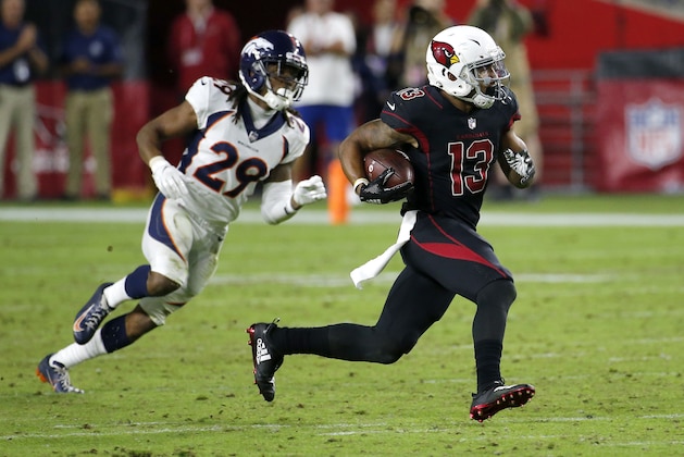 Arizona Cardinals wide receiver Christian Kirk (13) runs after the catch as Denver Broncos cornerback Bradley Roby (29) pursues during the second half of an NFL football game, Thursday, Oct. 18, 2018, in Glendale, Ariz. The Broncos won 45-10. (AP Photo/Rick Scuteri)