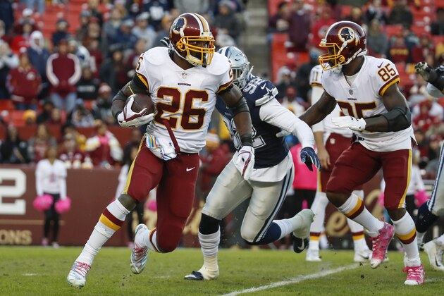 Washington Redskins running back Adrian Peterson (26) carries the ball during the second half of an NFL football game against the Dallas Cowboys, Sunday, Oct. 21, 2018, in Landover, Md. (AP Photo/Alex Brandon)