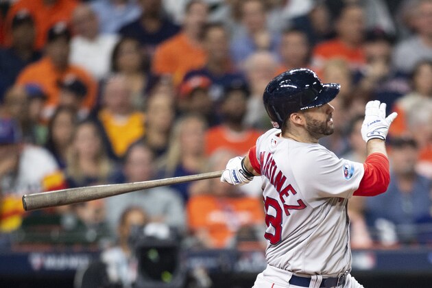 HOUSTON, TX - OCTOBER 18: J.D. Martinez #28 of the Boston Red Sox hits a solo home run during the third inning of game five of the American League Championship Series against the Houston Astros on October 18, 2018 at Minute Maid Park in Houston, Texas. (Photo by Billie Weiss/Boston Red Sox/Getty Images)