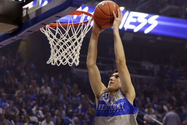 Kentucky's Tyler Herro dunks during Big Blue madness, marking the beginning of the NCAA college basketball season, Friday, Oct. 12, 2018, in Lexington, Ky. (AP Photo/James Crisp)