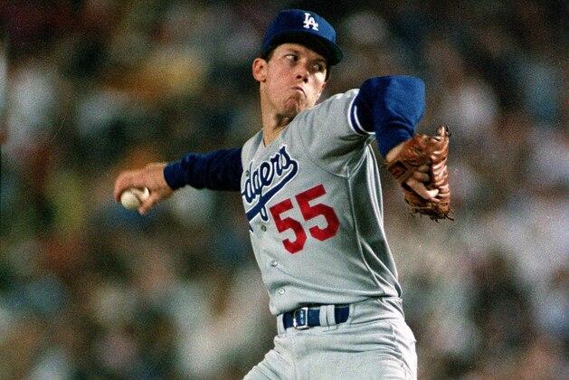 Los Angeles Dodgers pitcher Orel Hershiser winds up for a pitch against the San Diego Padres in San Diego, Ca., Wednesday night, Sept. 28, 1988.  Hershiser is attempting to tie former Dodger pitcher Don Drysdale's record whose 58.2 scoreless innings came in 1968.  (AP Photo/Lenny Ignelzi)