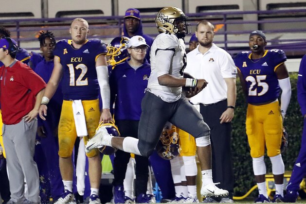 Central Florida's Darriel Mack Jr. (8) runs the ball during the second half of an NCAA college football game against East Carolina, in Greenville, N.C., Saturday, Oct. 20, 2018. UCF won 37-10. (AP Photo/Karl B DeBlaker)