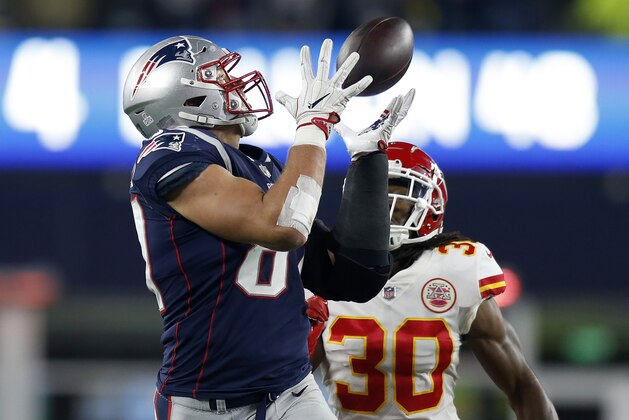 FILE - In this Sunday, Oct. 14, 2018, file photo, New England Patriots tight end Rob Gronkowski, left, catches a pass in front of Kansas City Chiefs safety Josh Shaw (30) during the second half of an NFL football game in Foxborough, Mass. Gronkowski was the runaway choice this week as the NFL's top tight end by a panel of 10 football writers for The Associated Press. (AP Photo/Michael Dwyer, File)