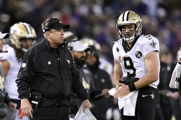 New Orleans Saints head coach Sean Payton, left, speaks with quarterback Drew Brees in the second half of an NFL football game against the Baltimore Ravens, Sunday, Oct. 21, 2018, in Baltimore. (AP Photo/Gail Burton)