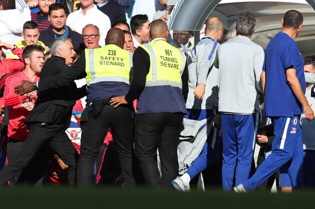 LONDON, ENGLAND - OCTOBER 20: Stewards hold back Jose Mourinho, Manager of Manchester United Chelsea assistant Marco Ianni makes his way towards the tunnel  during the Premier League match between Chelsea FC and Manchester United at Stamford Bridge on October 20, 2018 in London, United Kingdom. (Photo by Catherine Ivill/Getty Images)