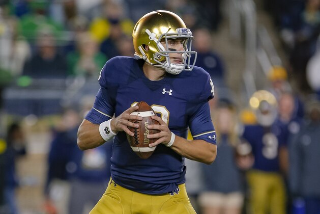 SOUTH BEND, IN - SEPTEMBER 29: Ian Book #12 of the Notre Dame Fighting Irish drops back to throw during the game against the Stanford Cardinal at Notre Dame Stadium on September 29, 2018 in South Bend, Indiana. (Photo by Michael Hickey/Getty Images)