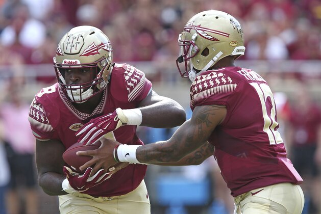 Florida State's Jacques Patrick takes a hand off from quarterback Deondre Francois in the first quarter of an NCAA college football game with Wake Forest, Saturday, Oct. 20, 2018 in Tallahassee, Fla. (AP Photo/Steve Cannon)