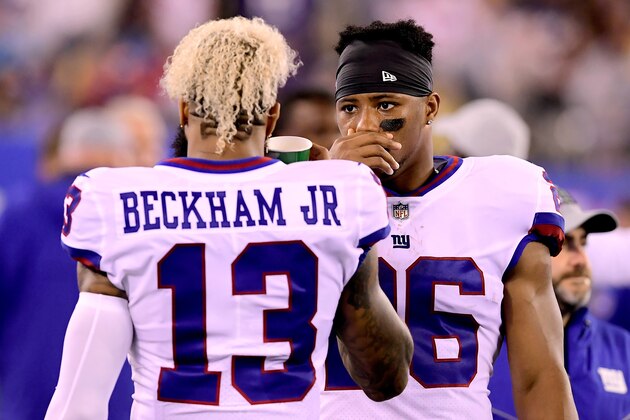 EAST RUTHERFORD, NJ - OCTOBER 11:  Odell Beckham #13 and Saquon Barkley #26 of the New York Giants in conversation during the game against the Philadelphia Eagles at MetLife Stadium on October 11, 2018 in East Rutherford, New Jersey. The Eagles defeated the Giants 34-13.  (Photo by Steven Ryan/Getty Images)