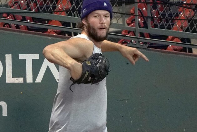 Los Angeles Dodgers starting pitcher Clayton Kershaw warms up in the bullpen, Monday, Oct. 22, 2018, in preparation for Game 1 of the World Series on Tuesday, against the Boston Red Sox in Boston. (AP Photo/Elise Amendola)