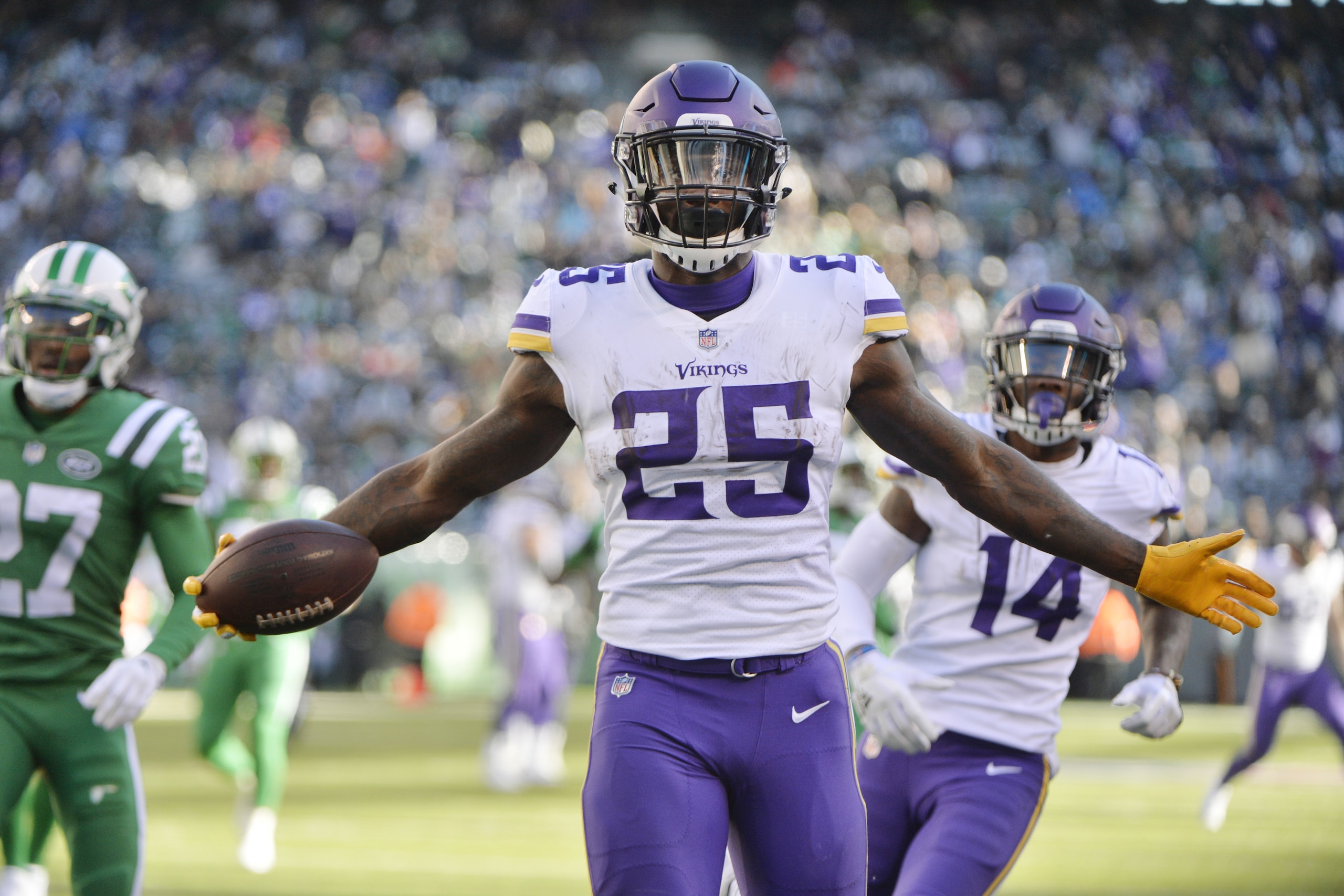 Minnesota Vikings running back Latavius Murray (25) celebrates after rushing for a 38-yard touchdown during the second half of an NFL football game against the New York Jets Sunday, Oct. 21, 2018, in East Rutherford, N.J. (AP Photo/Howard Simmons)