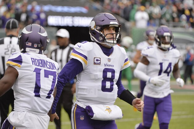 Minnesota Vikings quarterback Kirk Cousins (8) leaves the field after throwing a touchdown pass to Adam Thielen during the first half of an NFL football game against the New York Jets Sunday, Oct. 21, 2018, in East Rutherford, N.J. (AP Photo/Howard Simmons)