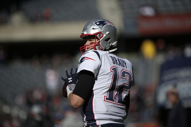 New England Patriots quarterback Tom Brady (12) warms up before an NFL football game Sunday, Oct. 21, 2018, in Chicago. (AP Photo/David Banks)