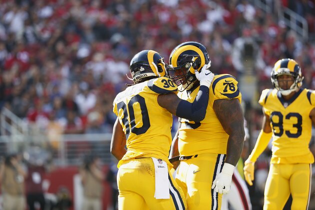 Los Angeles Rams running back Todd Gurley II (30) celebrates with guard Rodger Saffold (76) after scoring a touchdown against the San Francisco 49ers during the first half of an NFL football game in Santa Clara, Calif., Sunday, Oct. 21, 2018. (AP Photo/Tony Avelar)
