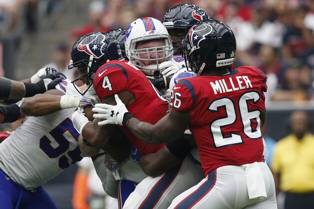 HOUSTON, TX - OCTOBER 14:  Deshaun Watson #4 of the Houston Texans is sacked by Kyle Williams #95 of the Buffalo Bills in the first half at NRG Stadium on October 14, 2018 in Houston, Texas.  (Photo by Tim Warner/Getty Images)