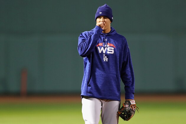 BOSTON, MA - OCTOBER 22:  Manny Machado #8 of the Los Angeles Dodgers looks on during workouts ahead of the 2018 World Series against the Boston Red Sox at Fenway Park on October 22, 2018 in Boston, Massachusetts.  (Photo by Elsa/Getty Images)