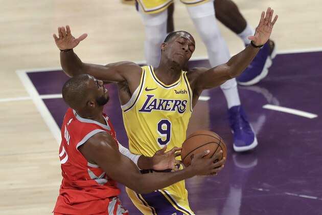 Los Angeles Lakers' Rajon Rondo (9) defends on Houston Rockets' Chris Paul during the first half of an NBA basketball game Saturday, Oct. 20, 2018, in Los Angeles. (AP Photo/Marcio Jose Sanchez)