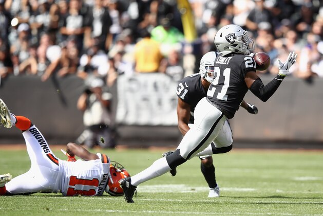 OAKLAND, CA - SEPTEMBER 30:  Gareon Conley #21 of the Oakland Raiders intercepts a pass intended for Antonio Callaway #11 of the Cleveland Browns and runs in back for a touchown at Oakland-Alameda County Coliseum on September 30, 2018 in Oakland, California.  (Photo by Ezra Shaw/Getty Images)