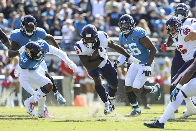 JACKSONVILLE, FL - OCTOBER 21: Lamar Miller #26 of the Houston Texans runs with the ball during the first half against the Jacksonville Jaguars at TIAA Bank Field on October 21, 2018 in Jacksonville, Florida.  (Photo by Sam Greenwood/Getty Images)
