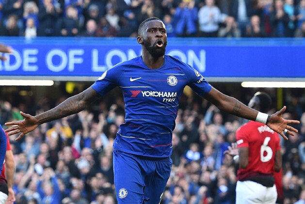 Chelsea's German defender Antonio Rudiger celebrates after scoring the opening goal of the English Premier League football match between Chelsea and Manchester United at Stamford Bridge in London on October 20, 2018. (Photo by Glyn KIRK / AFP) / RESTRICTED TO EDITORIAL USE. No use with unauthorized audio, video, data, fixture lists, club/league logos or 'live' services. Online in-match use limited to 120 images. An additional 40 images may be used in extra time. No video emulation. Social media in-match use limited to 120 images. An additional 40 images may be used in extra time. No use in betting publications, games or single club/league/player publications. /         (Photo credit should read GLYN KIRK/AFP/Getty Images)