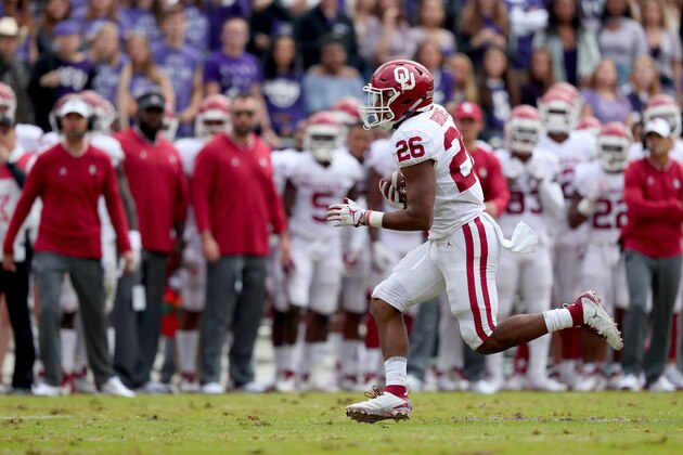 FORT WORTH, TX - OCTOBER 20:  Kennedy Brooks #26 of the Oklahoma Sooners carries the ball into the end zone to score a touchdown against the TCU Horned Frogs in the first half at Amon G. Carter Stadium on October 20, 2018 in Fort Worth, Texas.  (Photo by Tom Pennington/Getty Images)